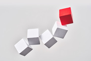 Abstract floating wooden dice on white background