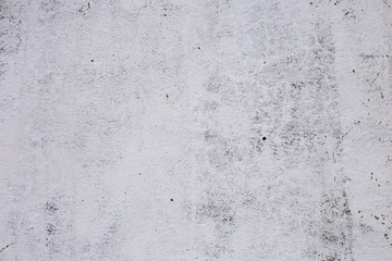 brick plastered wall with whitewash with potholes, cracks and stains, shot on a cloudy autumn day