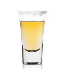 A glass of tequila with salt on the rim