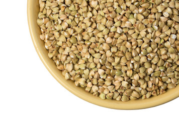 Natural fresh green buckwheat in ceramic bowl on white background.