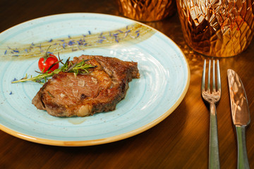 Grilled pork meat on plate with tomato