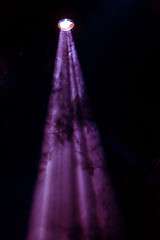 Stage lights. Several projectors in the dark. Multi-colored light beams from the stage spotlights...