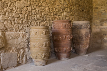 Huge ancient clay vases and camphor. Old dishes, camphor and pitchers. Storage of wine and food. Palace in Knossos, Greece.