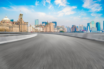 Obraz premium Blue sky, empty marble floor and skyline of Shanghai urban architecture.