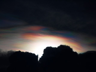 storm clouds with rainbow light