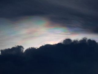 storm clouds with rainbow light