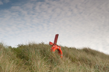 A lifebelt on the dunes at Budle Bay in Northumberland - 232263821