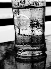 black and white Ice in water glass