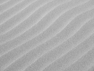 gray sand wave ripple at the beach