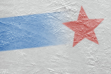 Fragment of the ice arena with a blue line and a red star