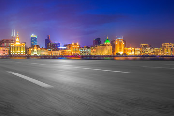 Fototapeta premium Empty asphalt road along modern commercial buildings in China's cities