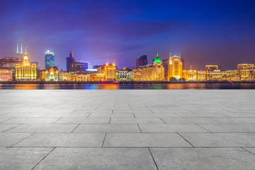 Fototapeta premium Blue sky, empty marble floor and skyline of Shanghai urban architecture.