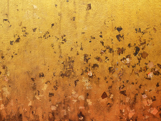 Gold leaf on Thai temple wall