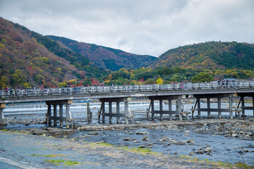 Togetsukyo Bridge in Arashiyama, Kyoto Prefecture, Japan during Koyo Autumn Leaves Festival 2018