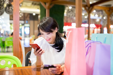 woman use phone and card