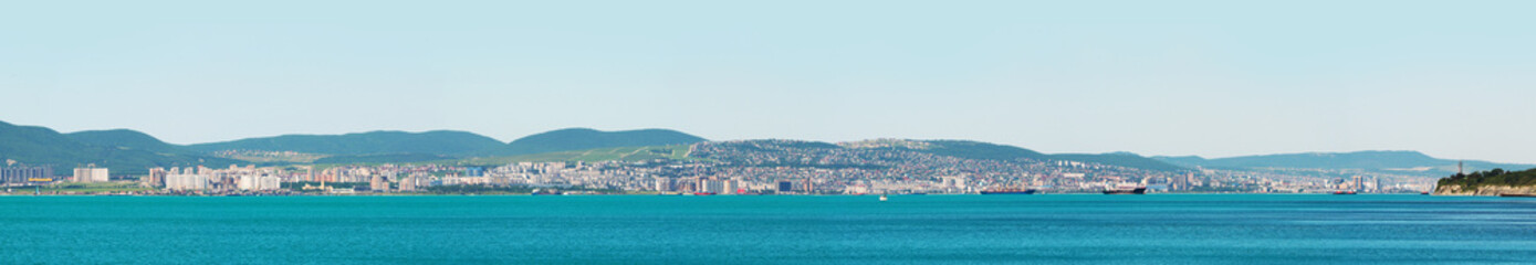 Naklejka na ściany i meble Panoramic view on the city of Novorossiysk, Novorossiysk Bay of Black sea. Russian port town, Krasnodar region. Tourism, travel, summertime