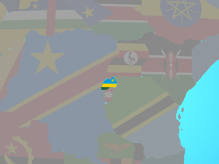 Rwanda with national flag on blue political globe.