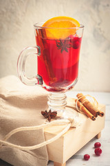 Glass cups of Christmas mulled red wine with spices and fruits