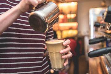 Hand on Barista making latte cafe, Cup of coffee