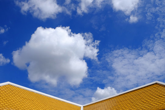 yellow roof with blue sky