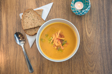 Aerial view above a bowl of healthy pumkin soup