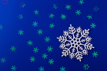 A gentle magic white snowflake from a fairy tale on a light pink background.