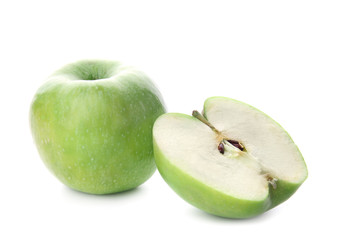 Whole and cut tasty apple on white background