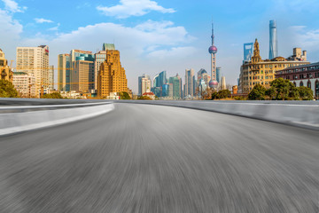 Obraz premium Empty asphalt road along modern commercial buildings in China's cities
