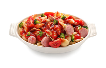 Delicious pasta with sausage and sauce in ceramic dish on white background