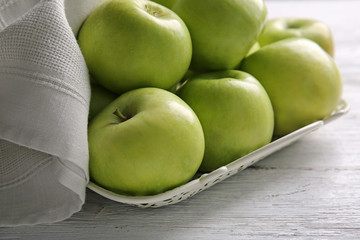 Ripe tasty apples on wooden table