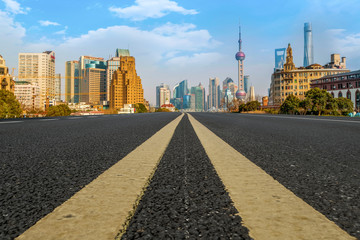 Obraz premium Empty asphalt road along modern commercial buildings in China's cities