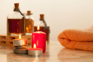 bath oils, candles and towel