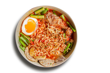 Hot and Spicy noodle in bowl and ingredients on isolated white background, Korea noodles with boil eggs, copy space and top view