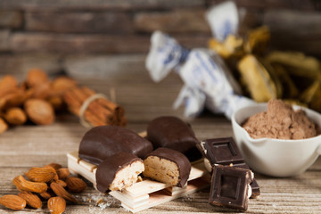 typical Spanish almond and chocolate polvorón with almonds and cocoa