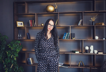 beautiful brunette woman in the living room and glasses