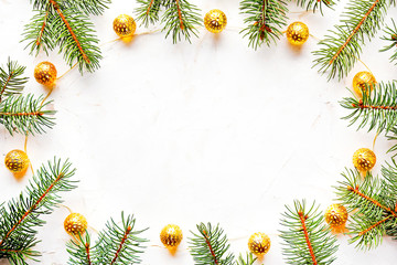 Christmas mood concept. Layout composition with traditional festive attributes, green decorative fresh pine tree branches. Winter holidays season. Background, copy space, close up, top view, flat lay.