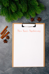 Blank paper with new year's resolutions. Goals. Targets. Flat lay. Top view. New year concept.