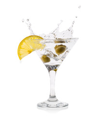 Martini splash with olives in a transparent glass