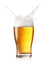 Splash of foam in a glass of beer