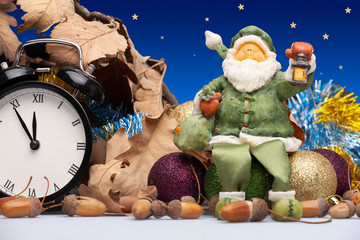 Christmas installation with decorations, a clock and a figure of Santa