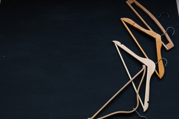 Obraz premium merchandise wooden hangers on a black background