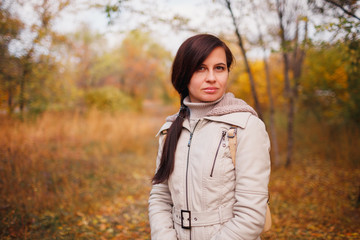 The woman in the yellow autumn park