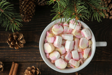 hot cocoa with marshmallows in a cup on a brown wooden background. View from above. Winter. new Year. Christmas