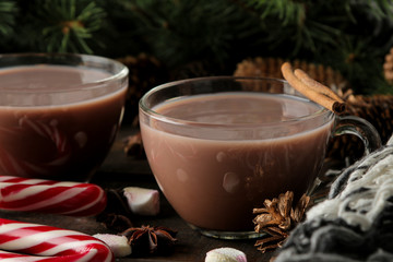 hot cocoa in a glass cup on a brown wooden background. Winter. new Year. Christmas. tree gifts