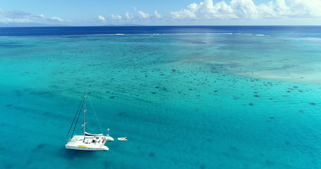 boat in aerial view, french polynesia - obrazy, fototapety, plakaty