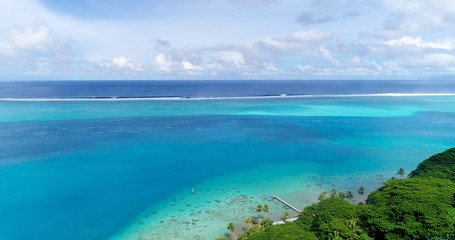 bungalow on the water in aerial view, french polynesia