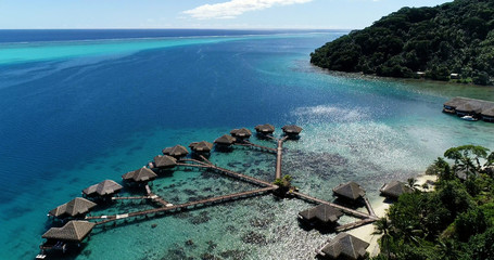 bungalow on the water in aerial view, french polynesia