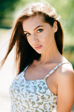 Closeup lifestyle portrait of celebrity female model.  Beautiful girl face on abstract nature background. Cheerful amazing young woman face expression. Sexy blue eyed babe. Glamour youth appearance.