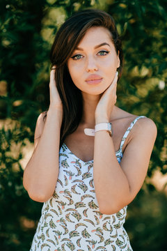 Closeup lifestyle portrait of celebrity female model.  Beautiful girl face on abstract nature background. Cheerful amazing young woman face expression. Sexy blue eyed babe. Glamour youth appearance.