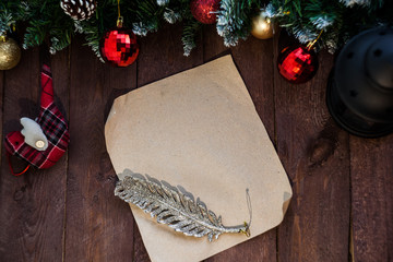 Christmas background, an empty wish list for Santa Claus on a brown wooden table. New Year's decor, fir branches.copy space